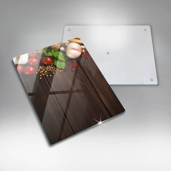 Tabla de cortar de vidrio Verduras en la mesa