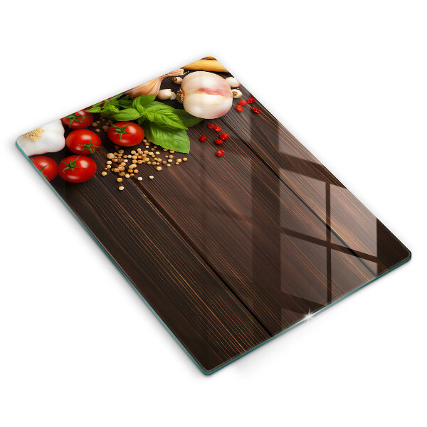 Tabla de cortar de vidrio Verduras en la mesa