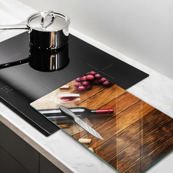 Tabla de cortar de vidrio Una botella de vino tinto