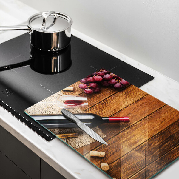 Tabla de cortar de vidrio Una botella de vino tinto