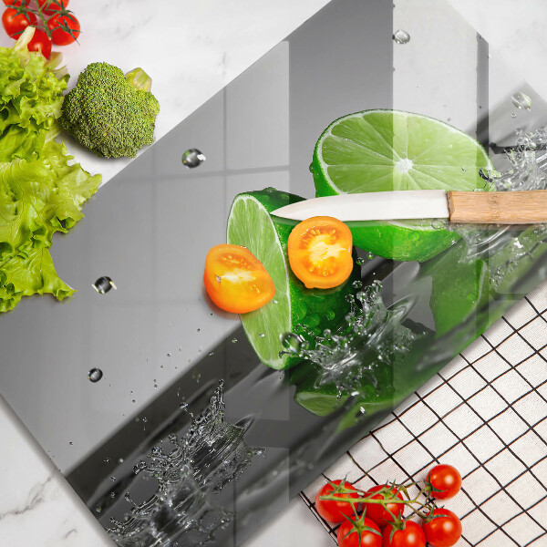 Tabla de cortar de vidrio Limas jugosas y agua