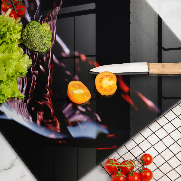 Tabla de cortar de vidrio Una copa de vino tinto