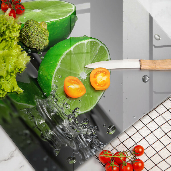 Tabla de cortar de vidrio Limas jugosas y agua