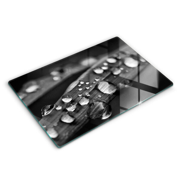 Tabla de cortar de vidrio Gotas de rocío sobre las hojas