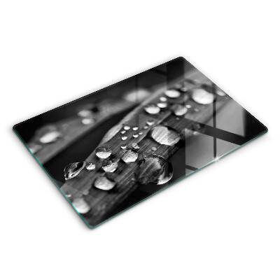 Tabla de cortar de vidrio Gotas de rocío sobre las hojas