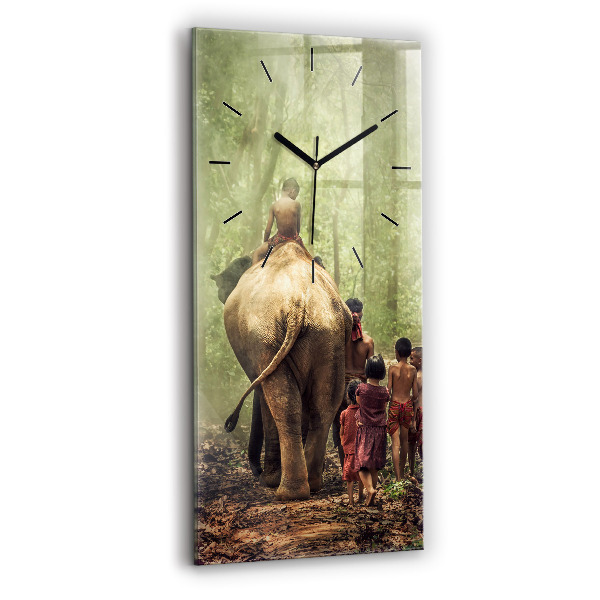Reloj de vidrio vertical Niños guiando a un elefante - espejomat.es
