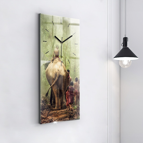 Reloj de vidrio vertical Niños guiando a un elefante - espejomat.es