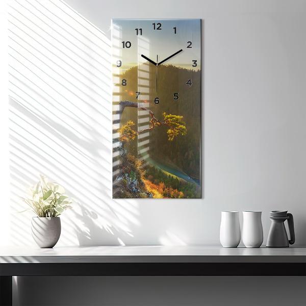 Reloj vertical Puesta de sol sobre montañas - espejomat.es