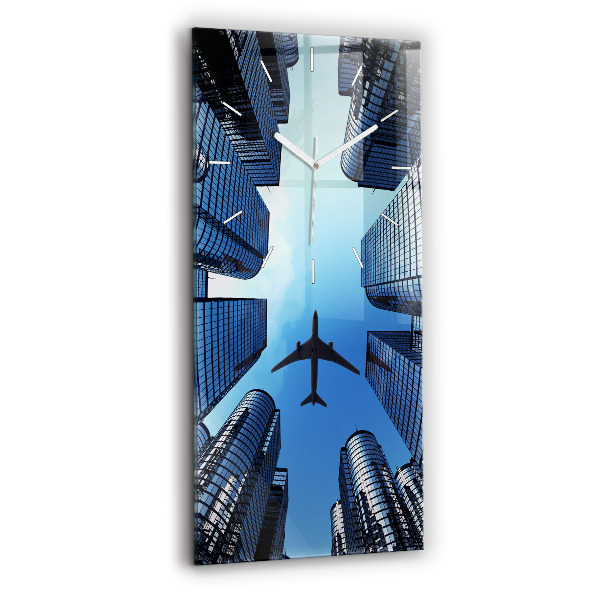 Reloj de vidrio vertical Avión sobre edificios - espejomat.es