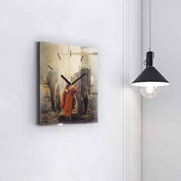 Reloj cuadrado Monje guiando elefantes