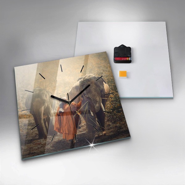 Reloj cuadrado Monje guiando elefantes