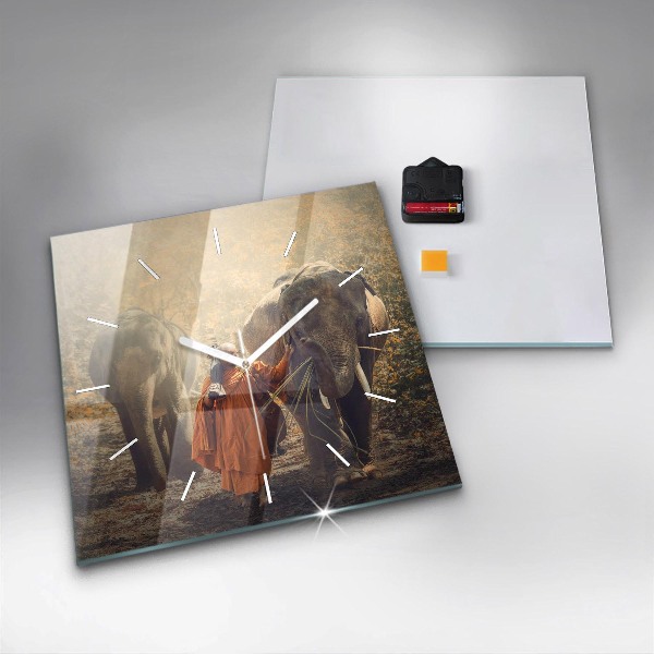 Reloj cuadrado Monje guiando elefantes
