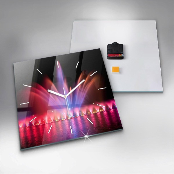 Reloj cuadrado Fuente de Wrocław por la noche