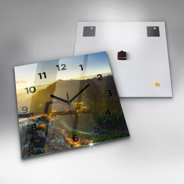 Reloj cuadrado Puesta de sol sobre montañas