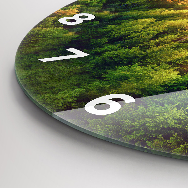 Reloj de cristal redondo Puesta de sol sobre las colinas