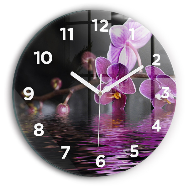 Reloj de cristal redondo Flor de orquídea sobre el agua