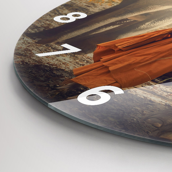 Reloj de pared redondo Monje guiando elefantes