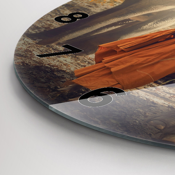 Reloj de pared redondo Monje guiando elefantes